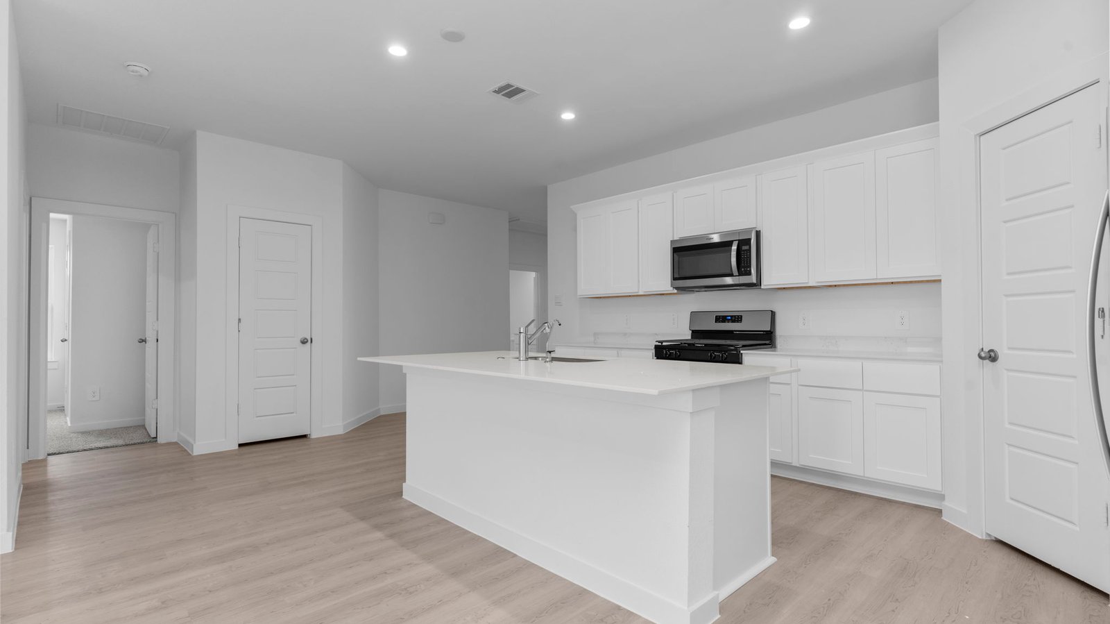 kitchen with large island and walk in pantry