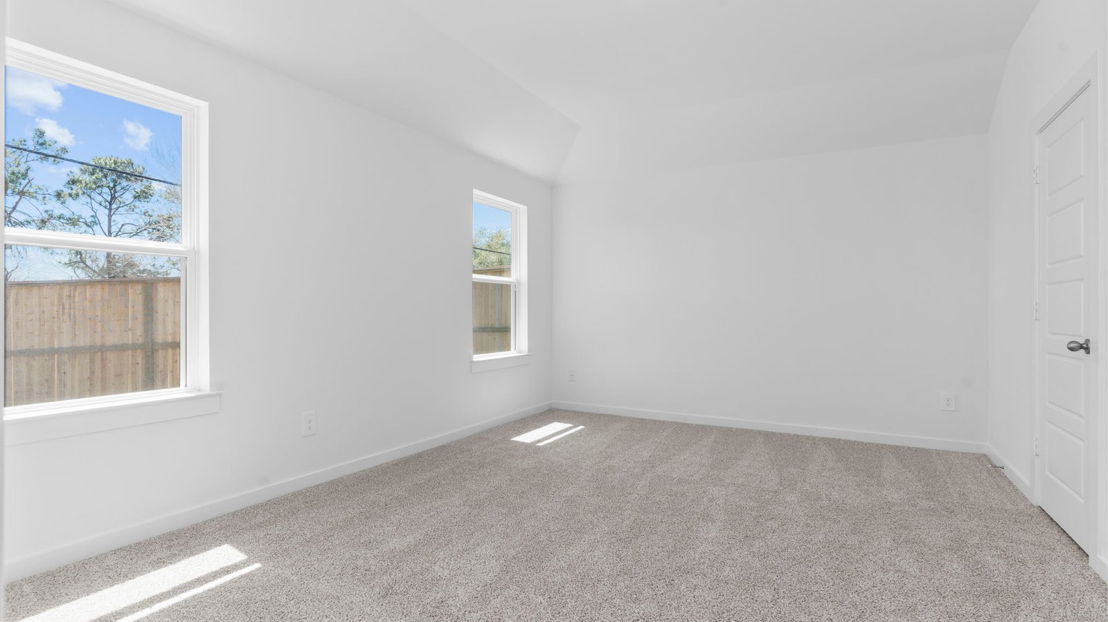 primary bedroom with two windows