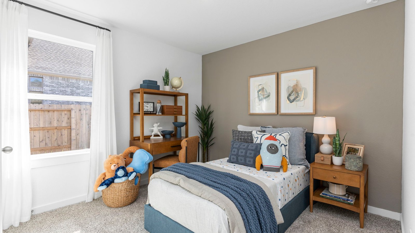 Comfortable guest bedroom featuring neutral-toned walls, carpeted flooring, and a separate closet.