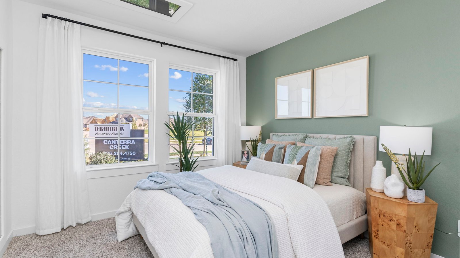 Comfortable guest bedroom featuring neutral-toned walls, carpeted flooring, and a separate closet.
