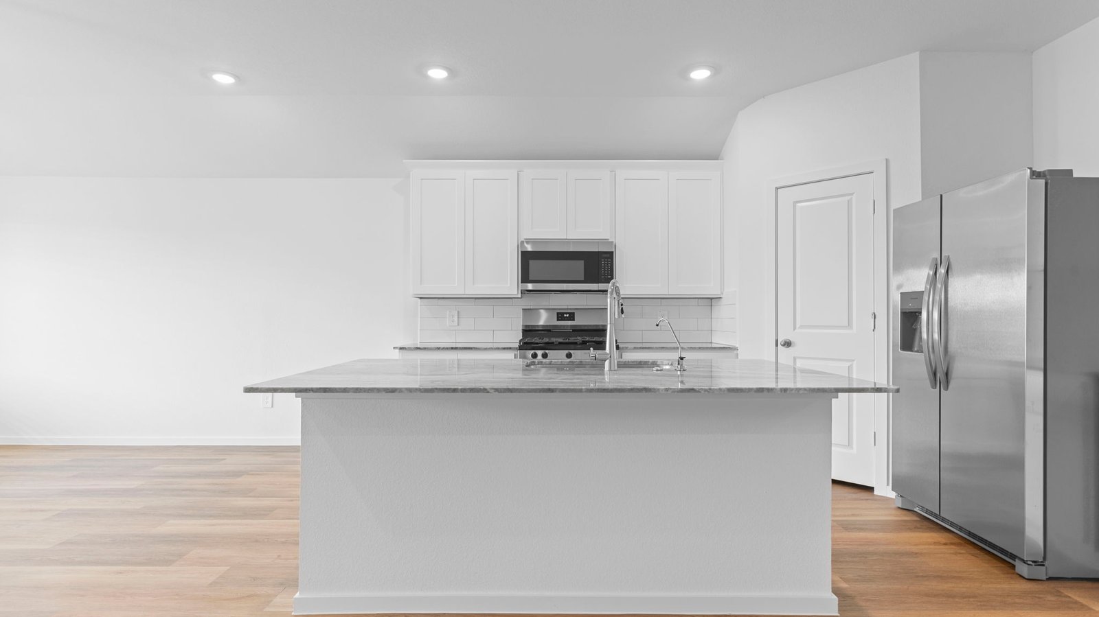 kitchen with large island and walk in pantry