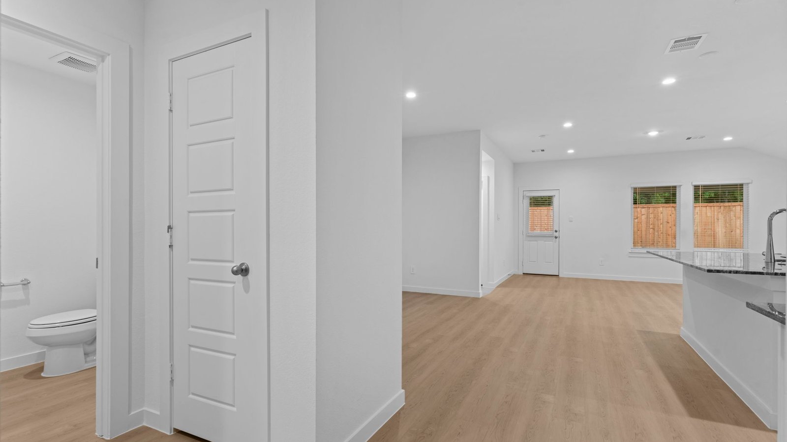 hallway leading to bedrooms and living room