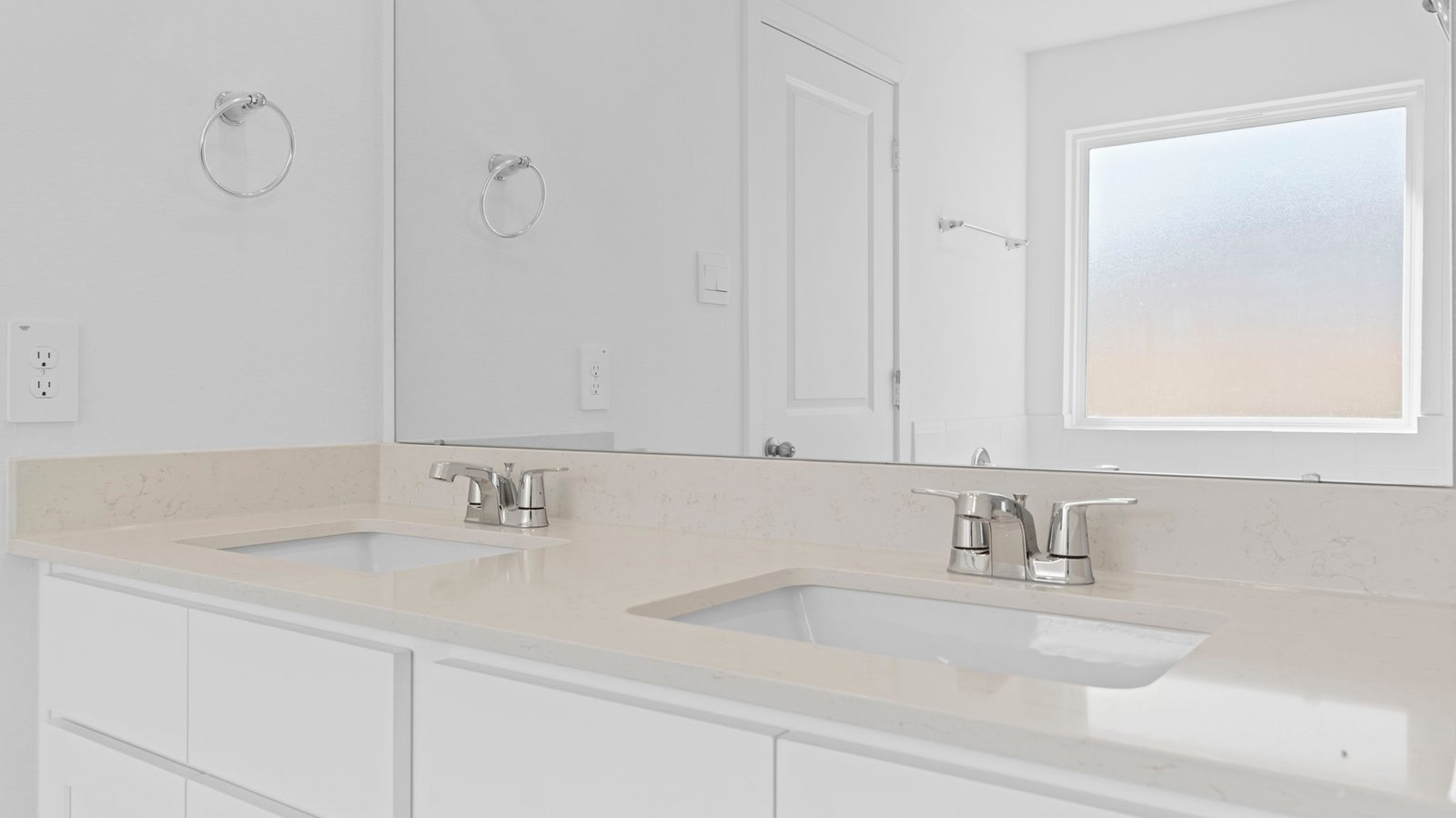 primary bathroom vanity with two sinks