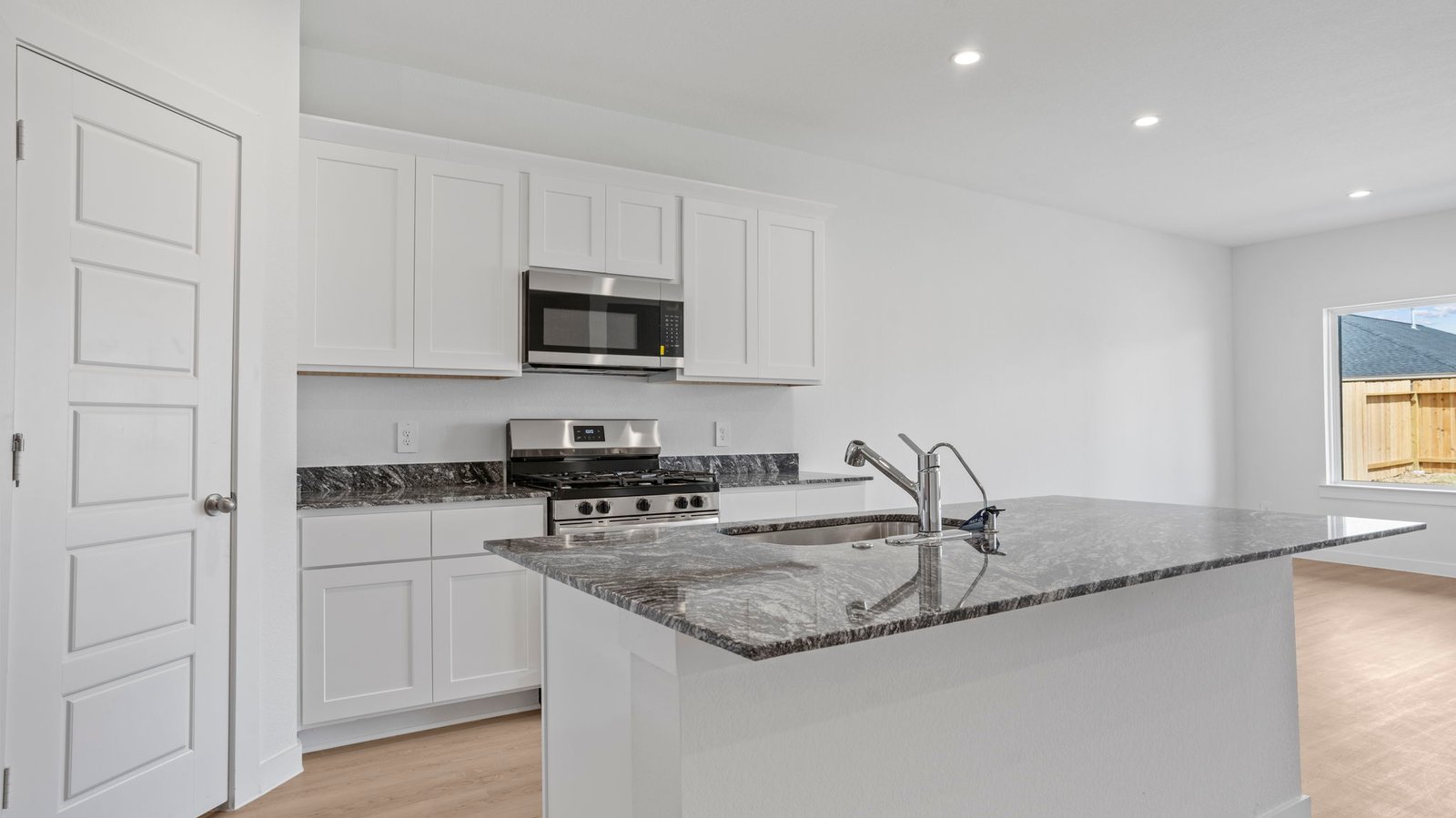 kitchen with walk in pantry and large island
