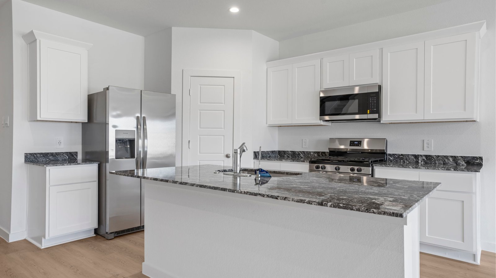 kitchen with walk in pantry and large island