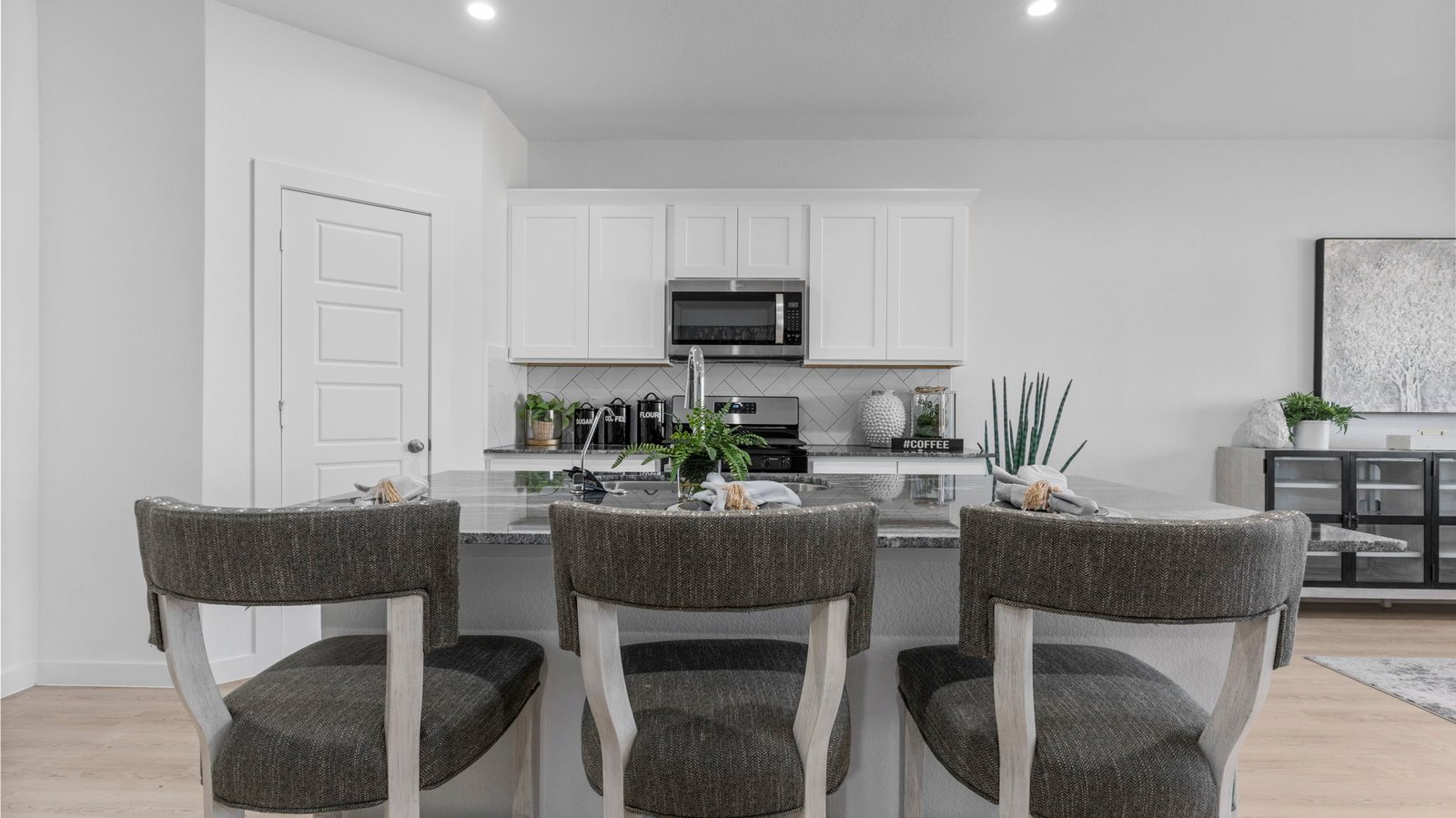 open concept kitchen with island and walk in pantry