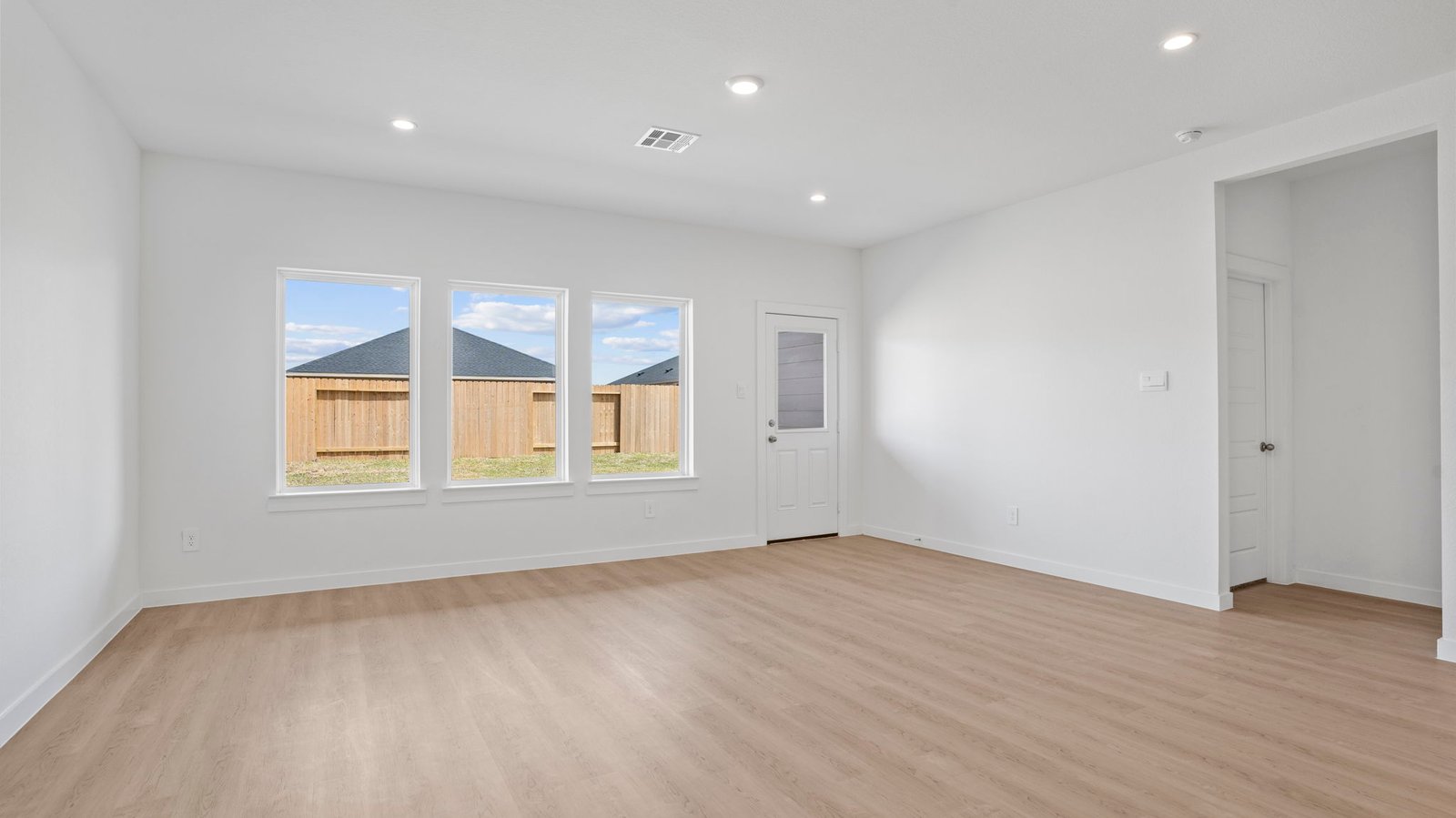 living room with multiple windows