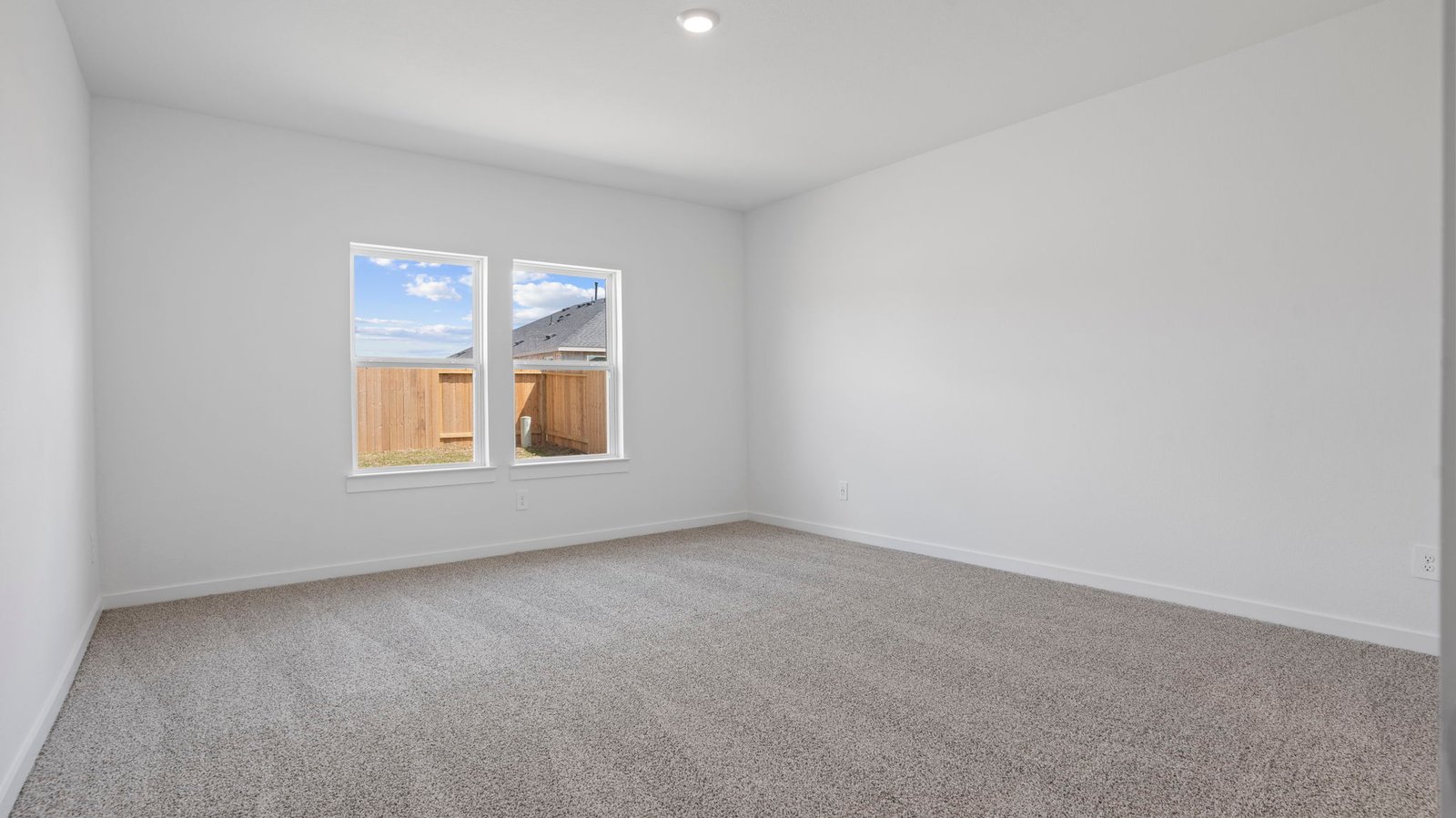 primary bedroom with two windows