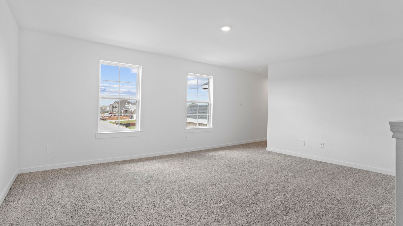 upstairs game room with two windows