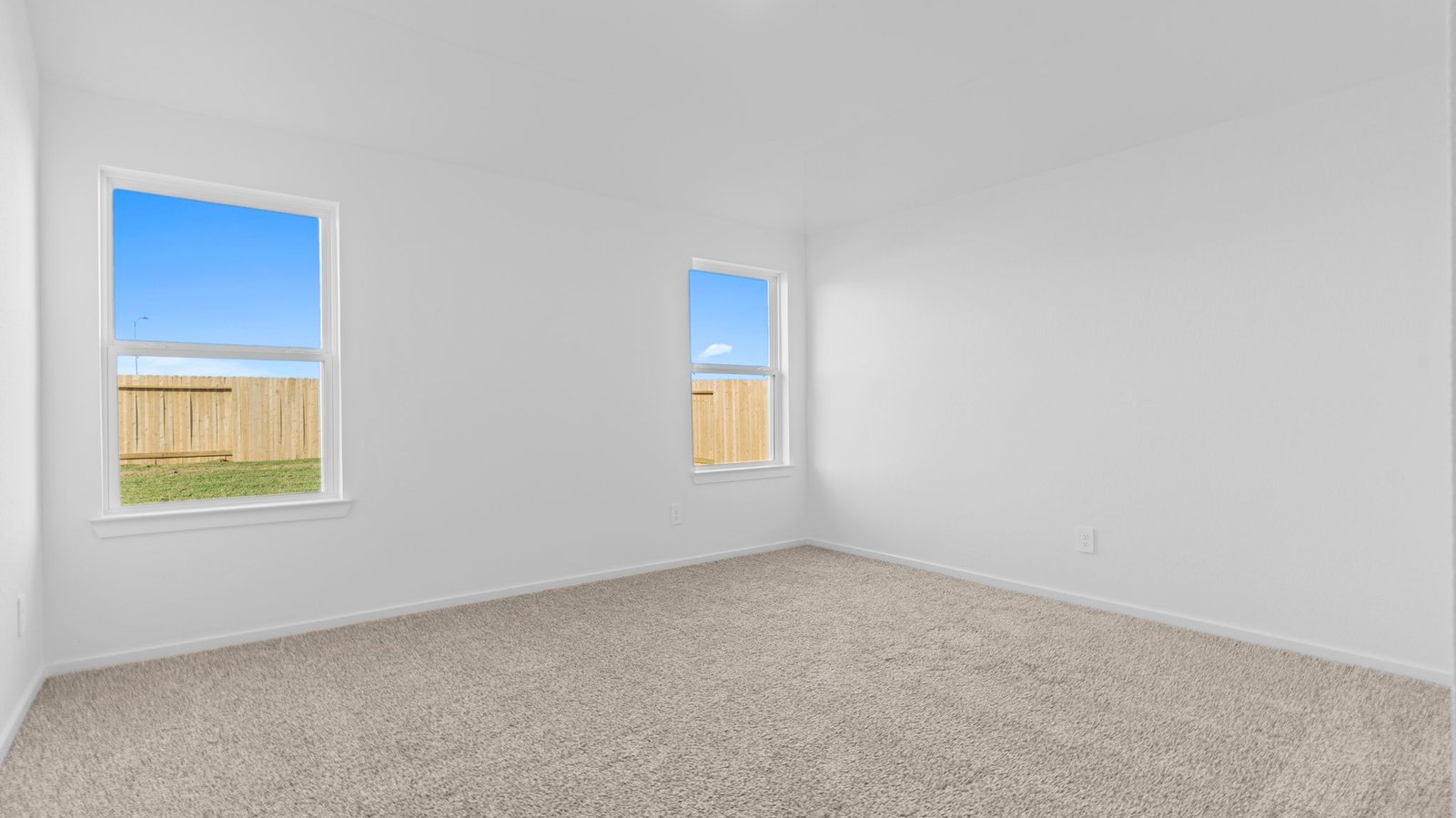 primary bedroom with two windows