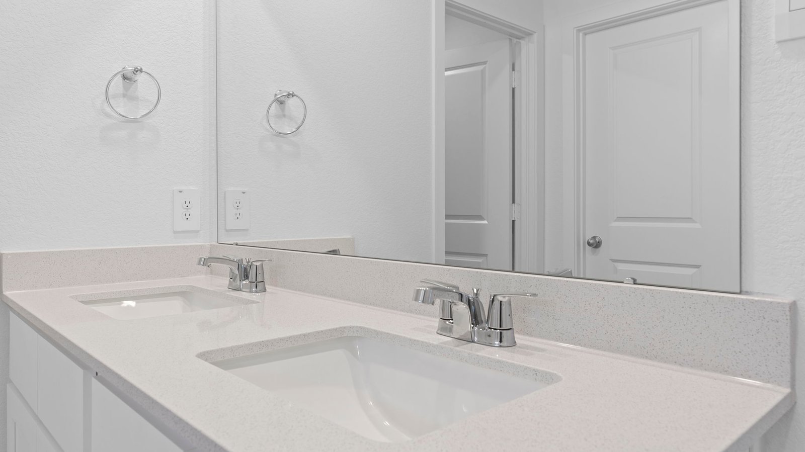 primary bathroom vanity with two sinks