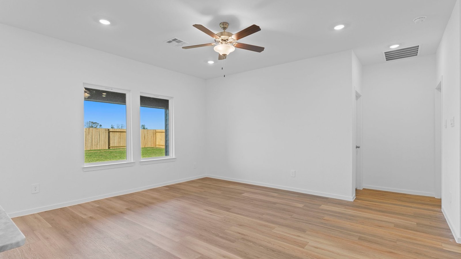 open concept living room with a large window