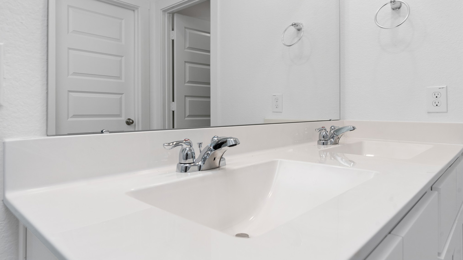 Primary bathroom vanity with two sinks
