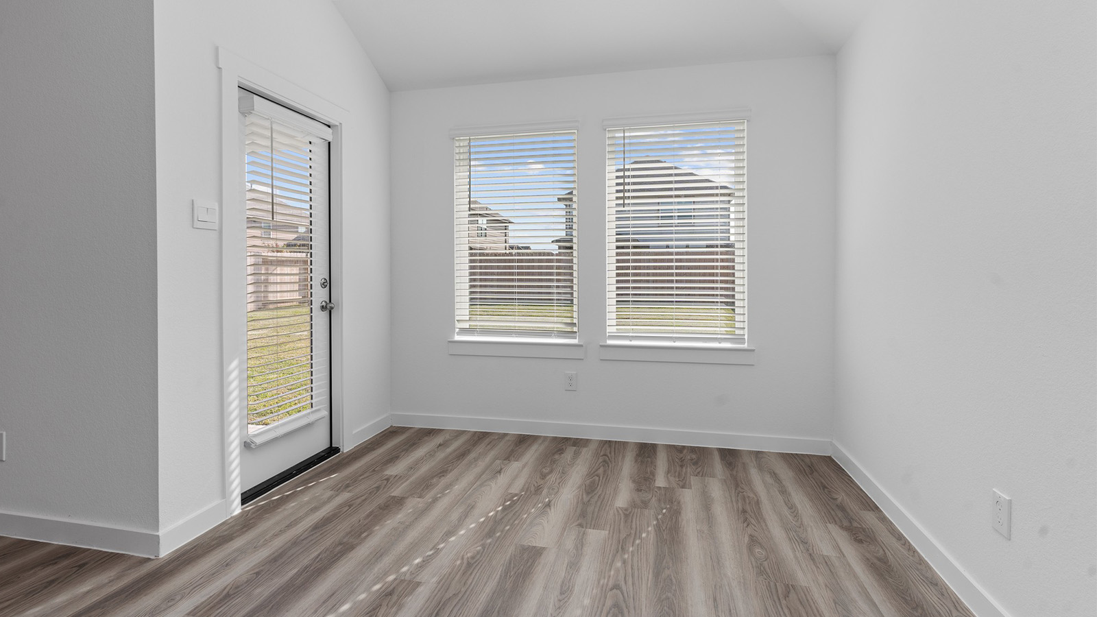 Dining room with back patio door and two large windows