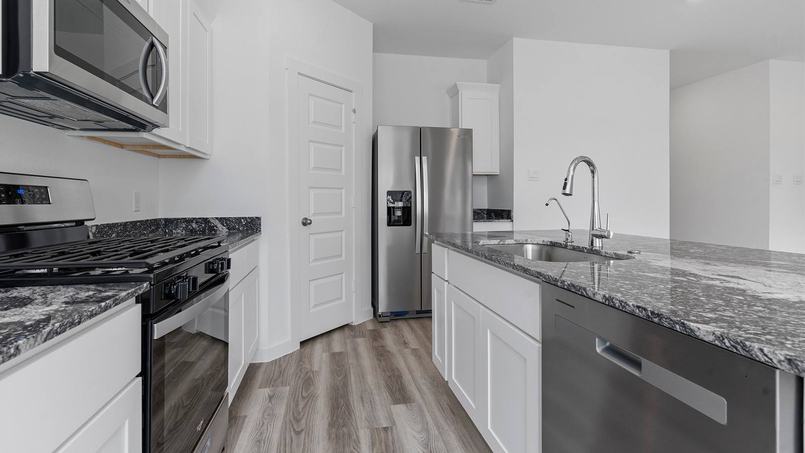 Kitchen with large island and a deep sink