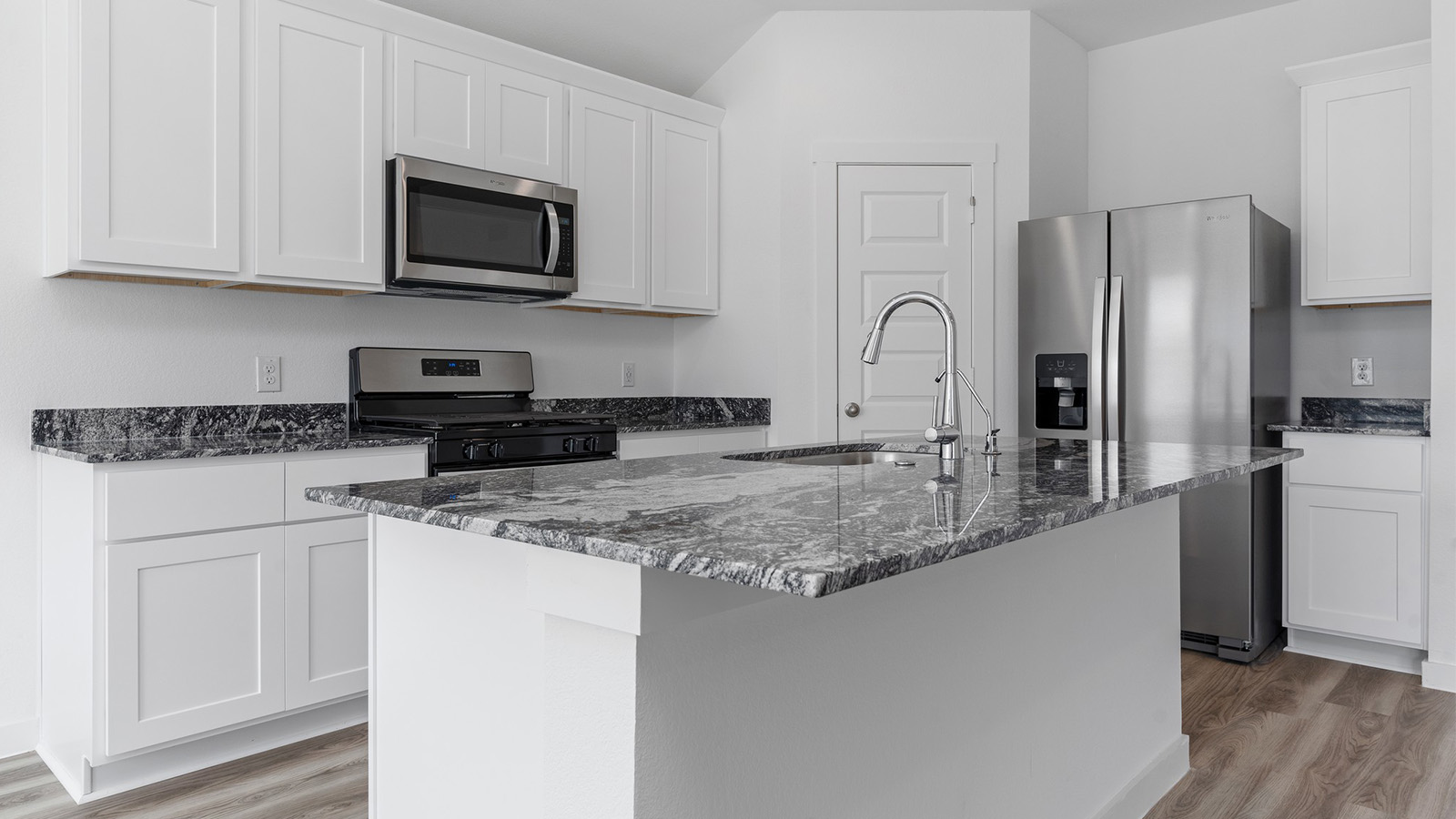 Kitchen with large island and stainless steel appliances