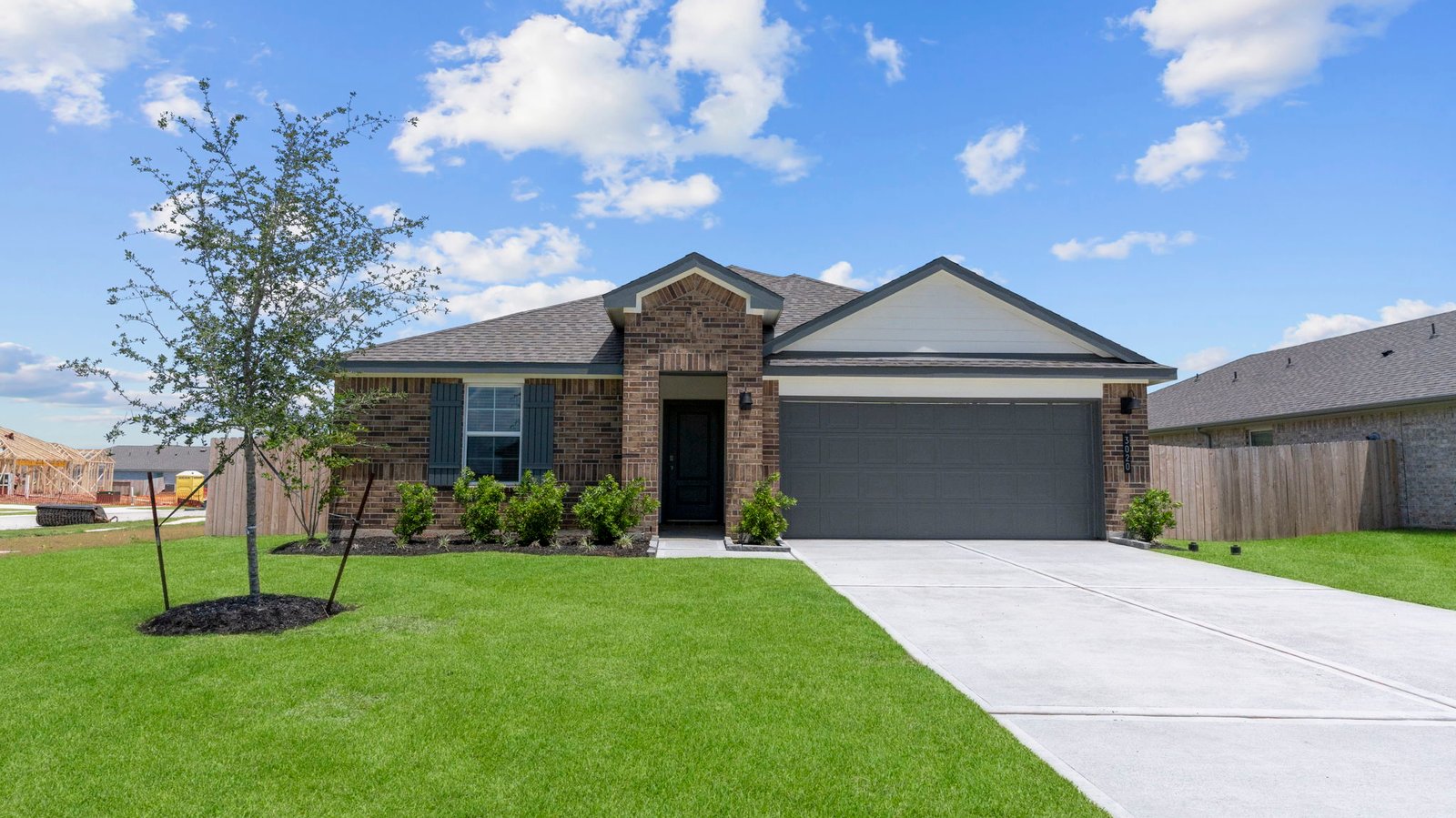 front exterior of a one story home with a two car garage