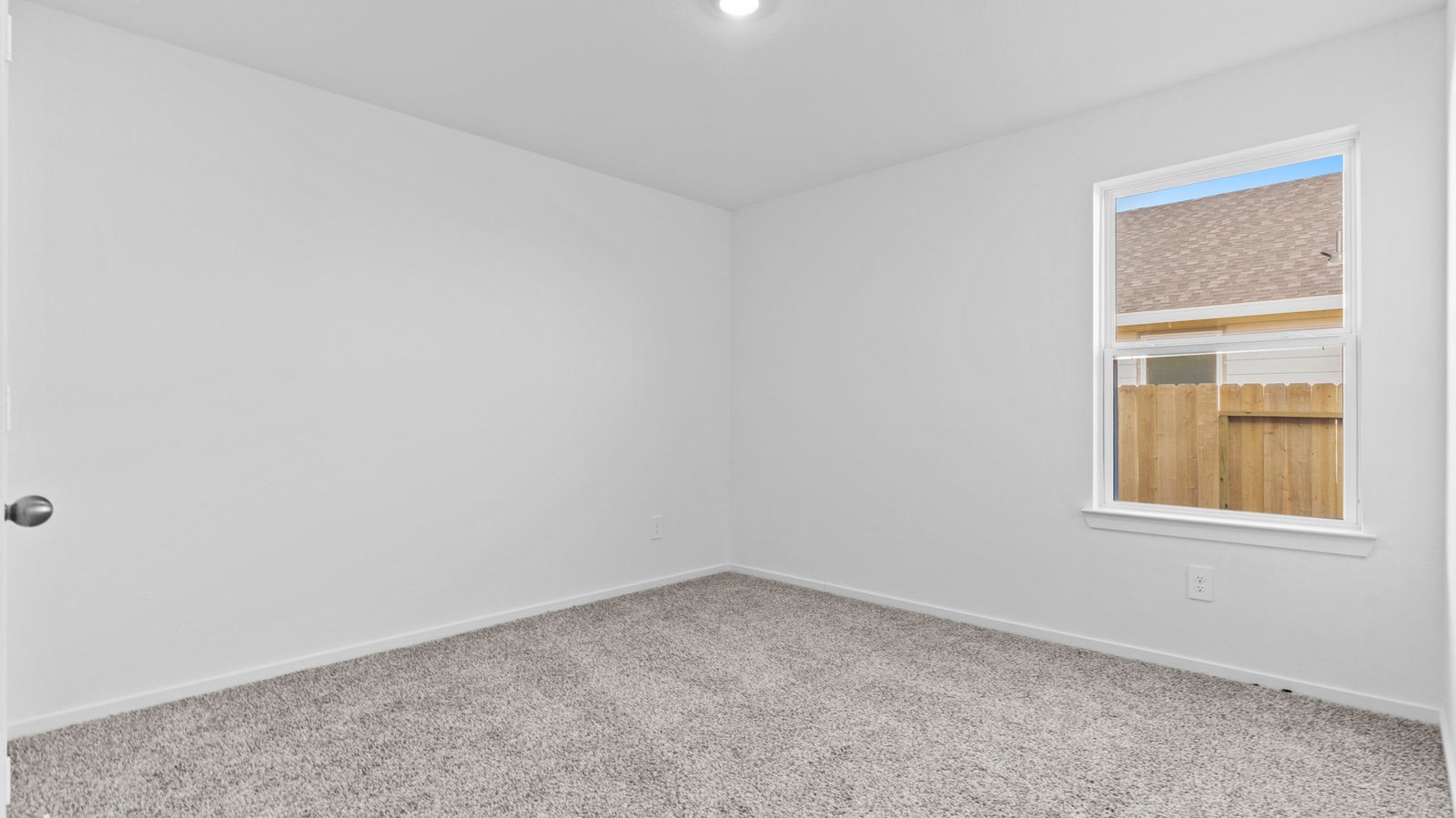 secondary bedroom with large window