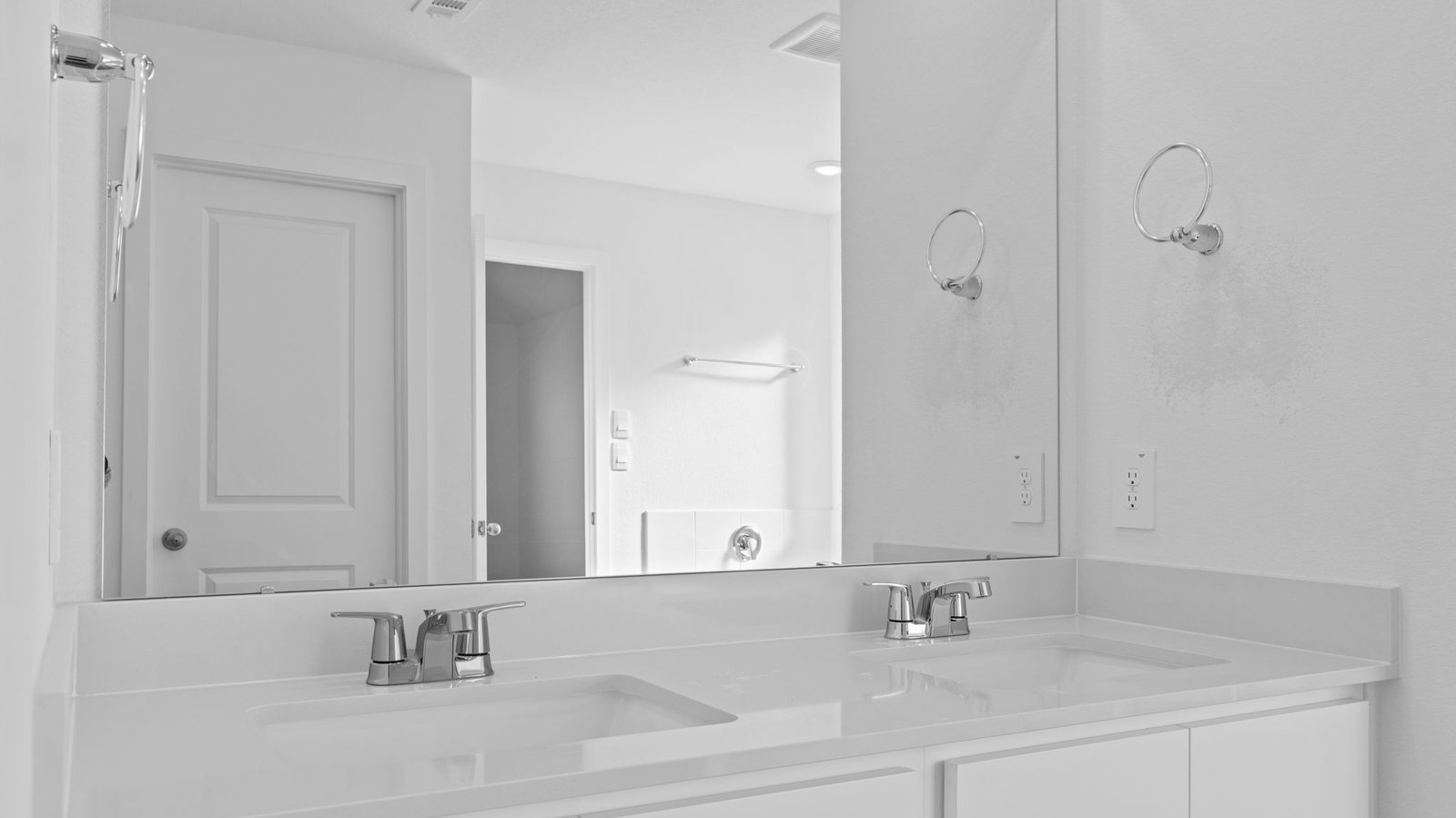 primary bathroom vanity with two sinks