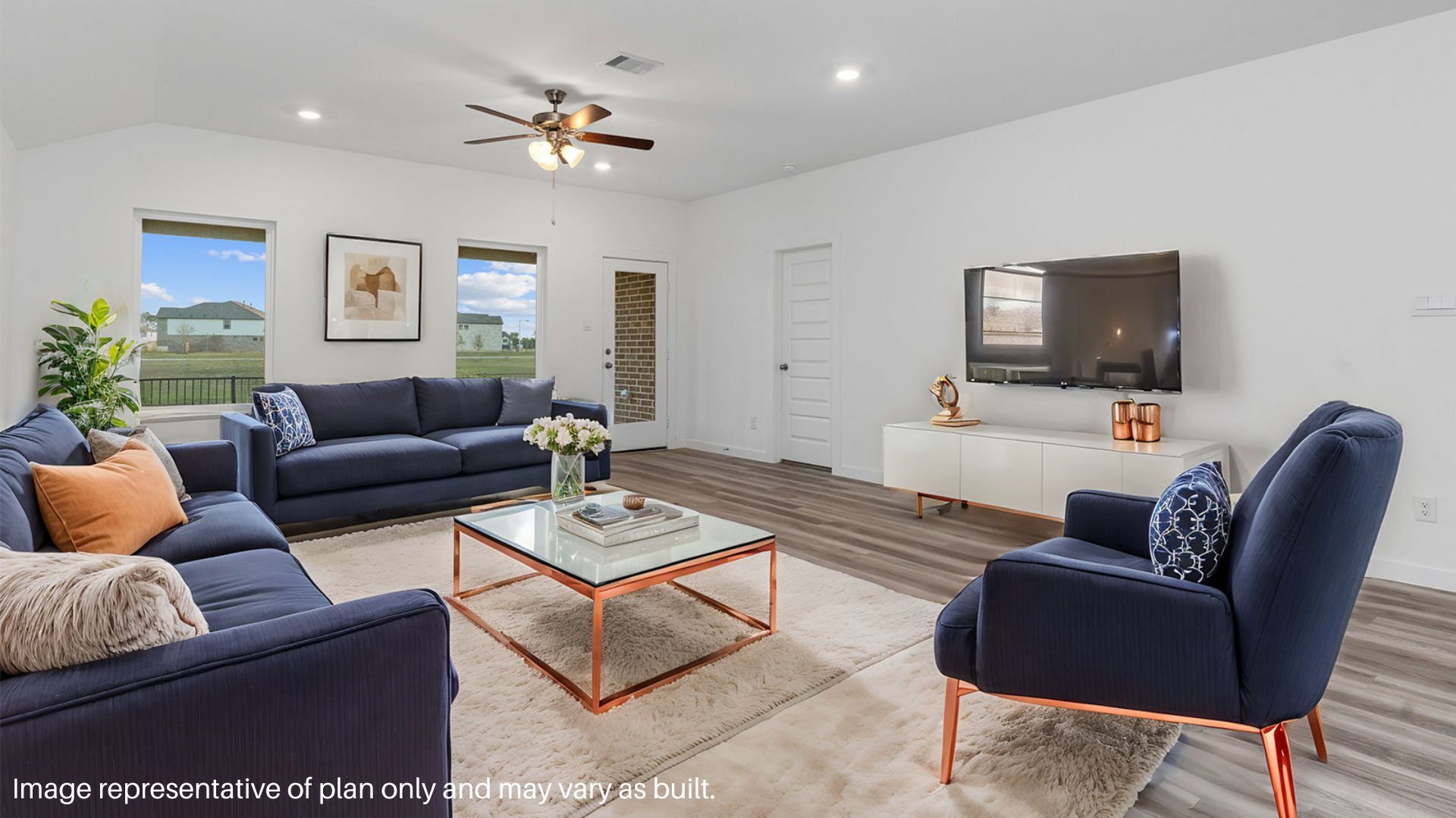 Spacious family room with vinyl flooring and bright windows.