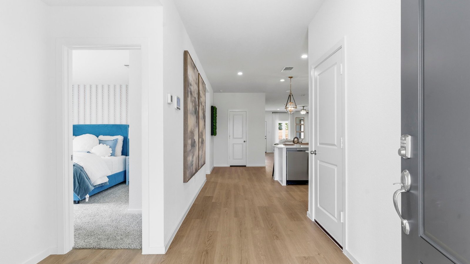Entry hallway leading to bedrooms in the background.