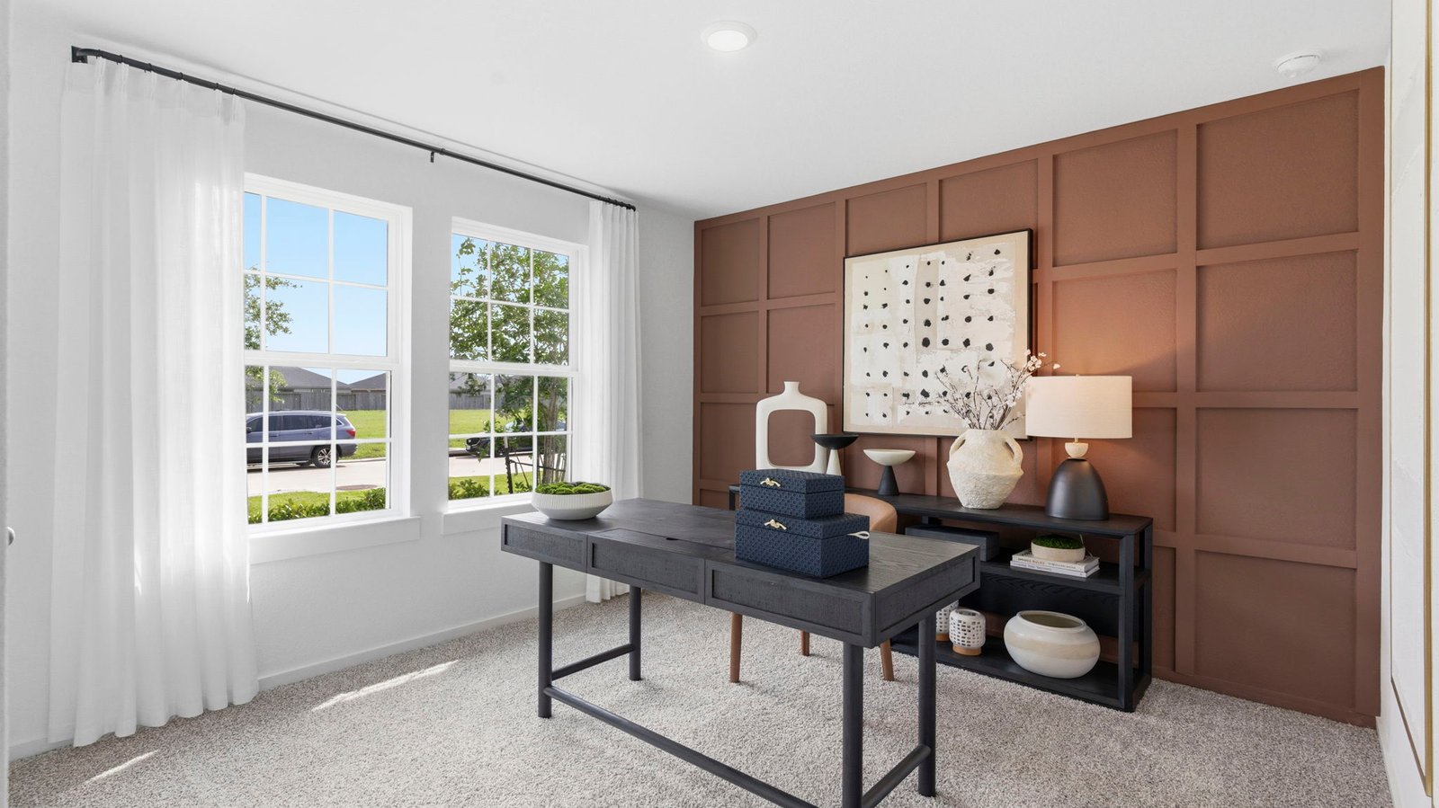 Comfortable guest bedroom featuring neutral-toned walls, carpeted flooring, and a separate closet.