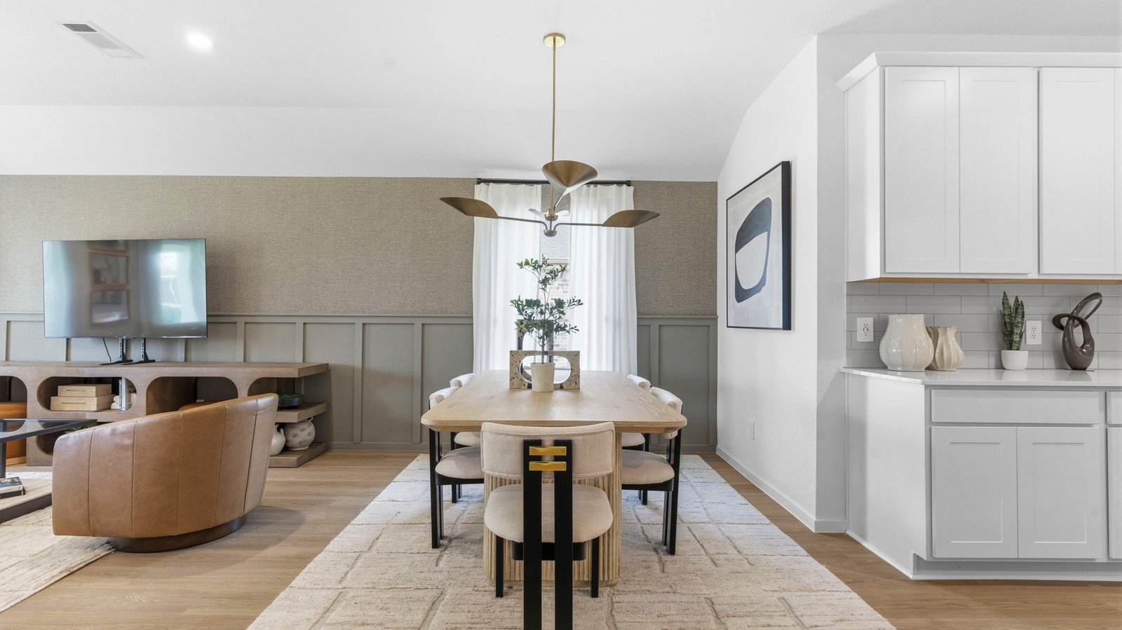Spacious open concept dining area with vinyl wood flooring and access to the living and kitchen areas