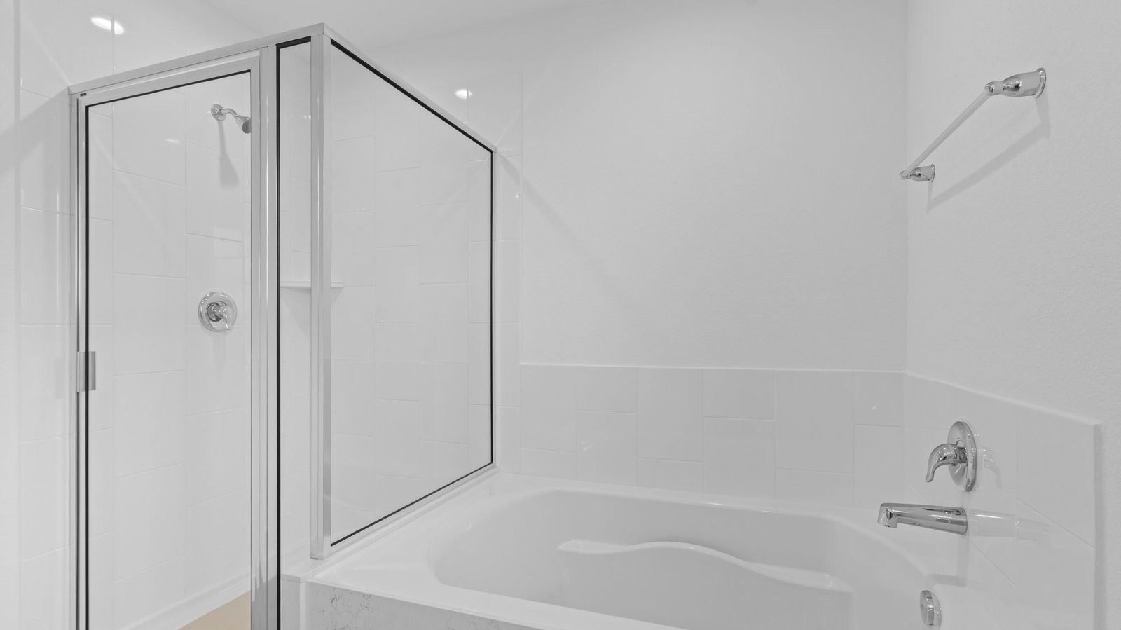 primary bathroom with shower and tub