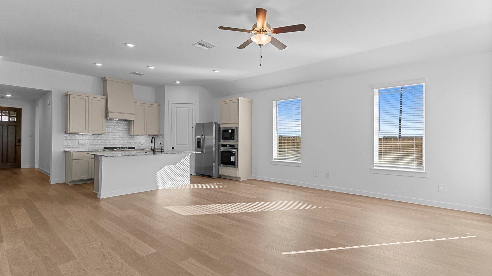 open concept kitchen dining and living room