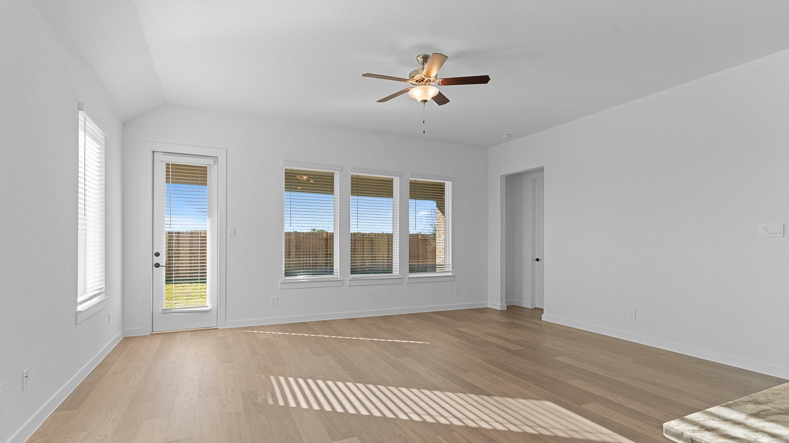 living room with multiple windows