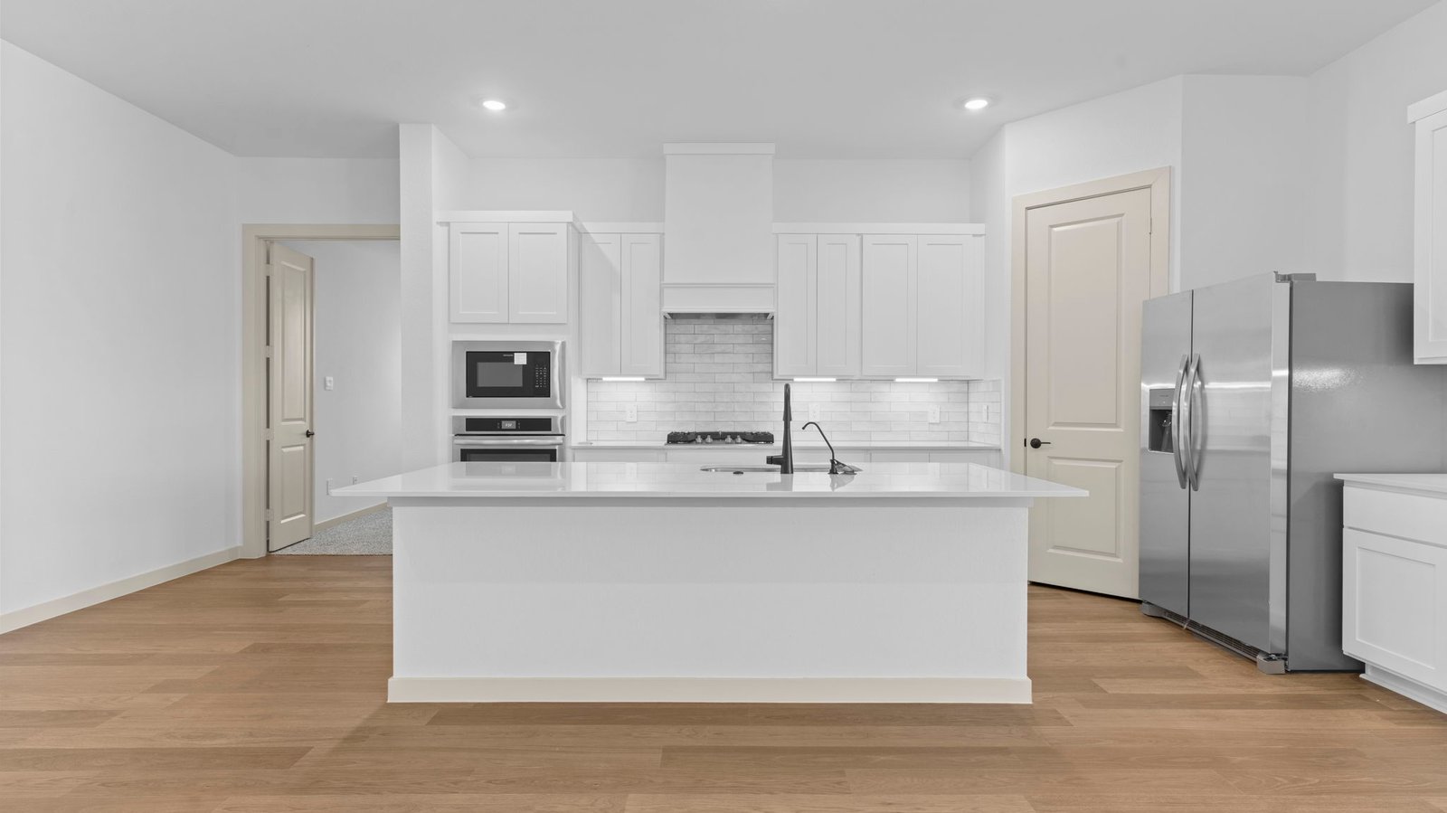 kitchen with large island and walk in pantry