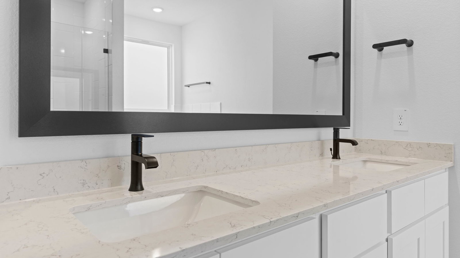 primary bathroom vanity with two sinks