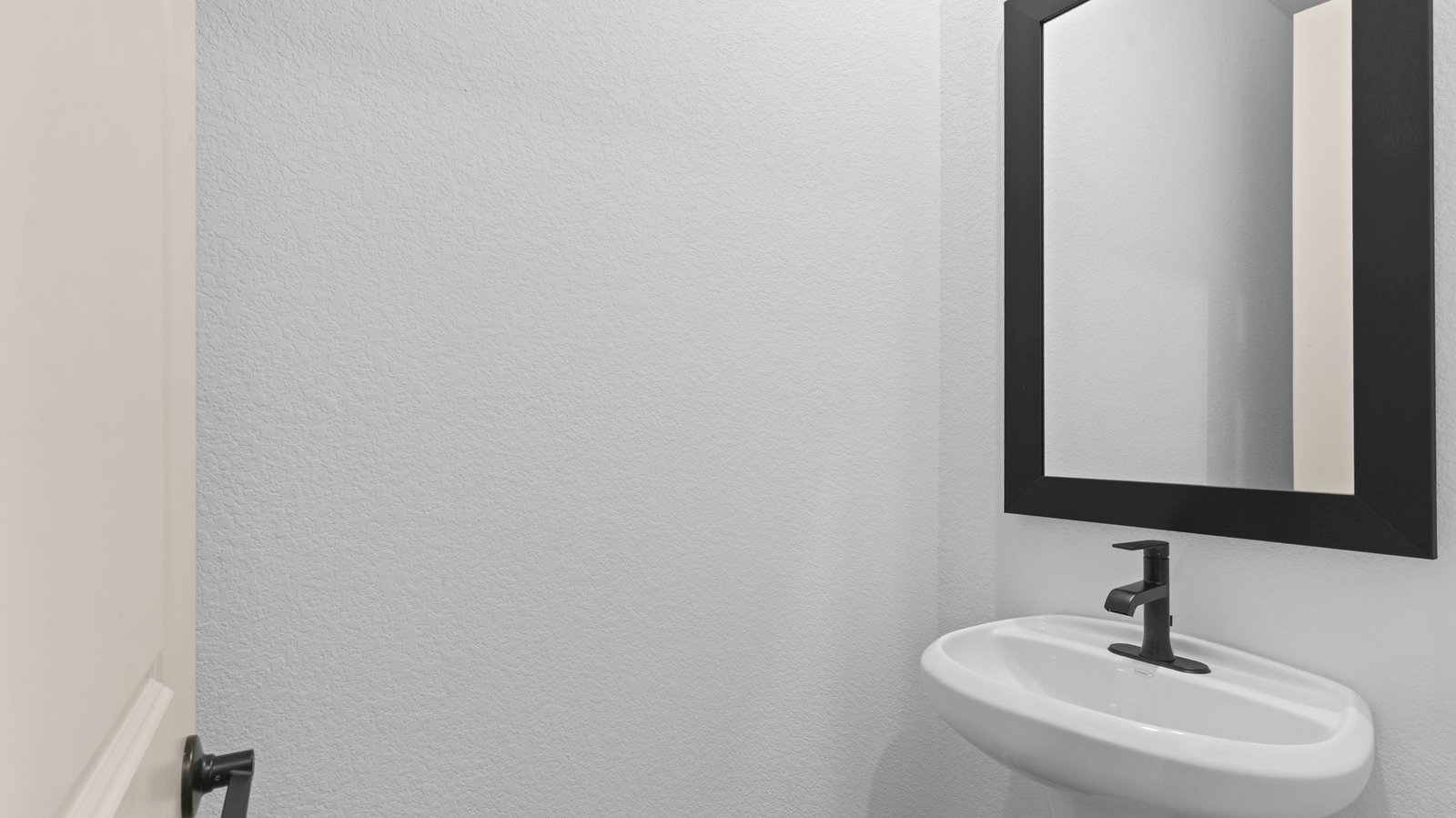 A decorated half bathroom downstairs for guests
