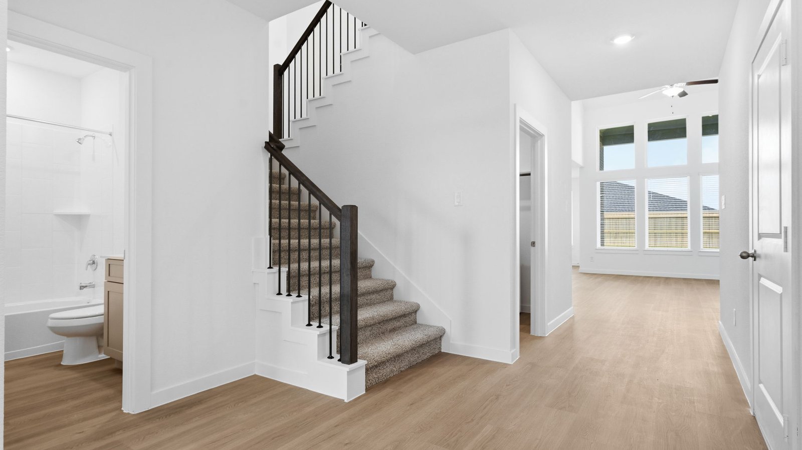Spacious entry foyer with grand staircase leading to the second floor
