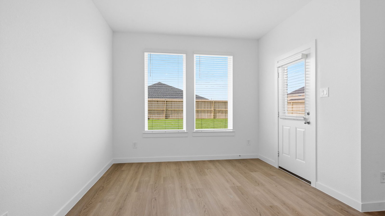An open concept breakfast room with a large window.
