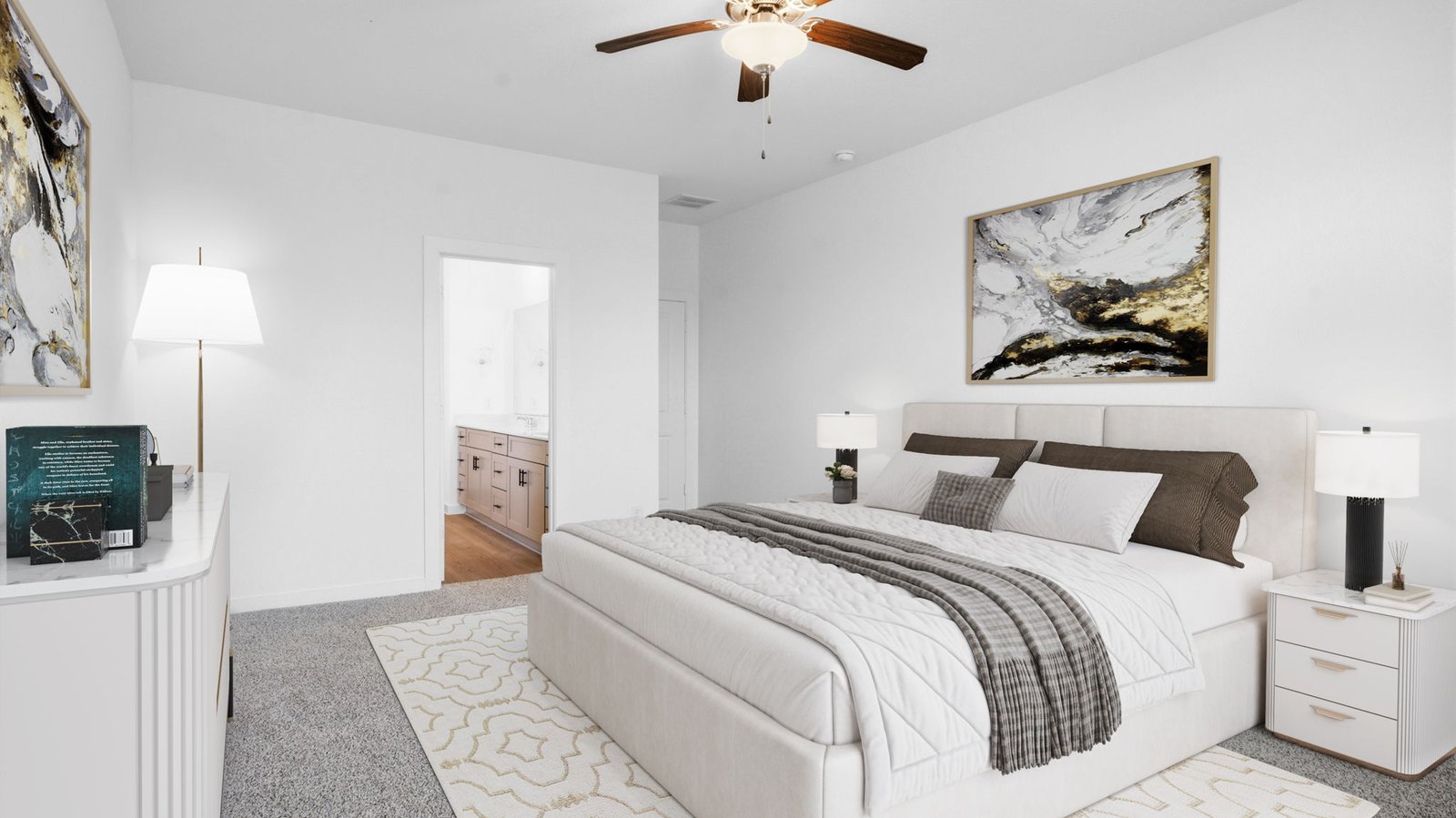 Primary bedroom with ceiling fan, plush carpeting, and a large walk-in closet.