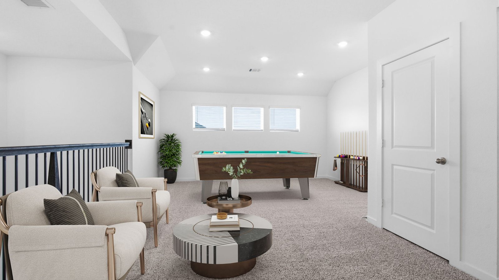 A spacious upstairs living area with plenty of natural light from windows overlooking side of the home