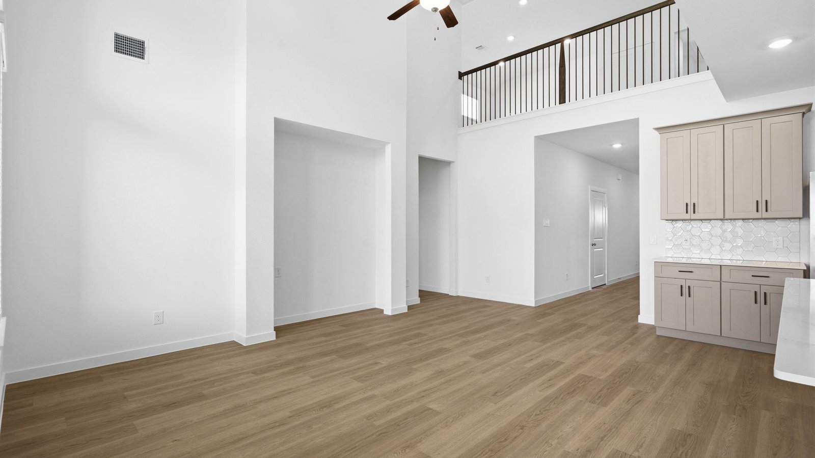 open concept living room with large windows and tall celling's