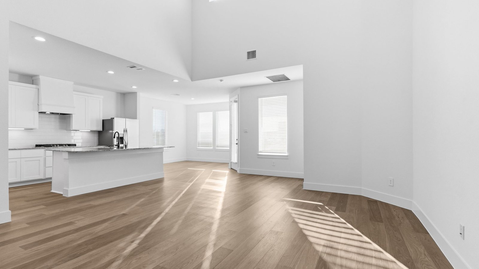 open concept kitchen dining and living room