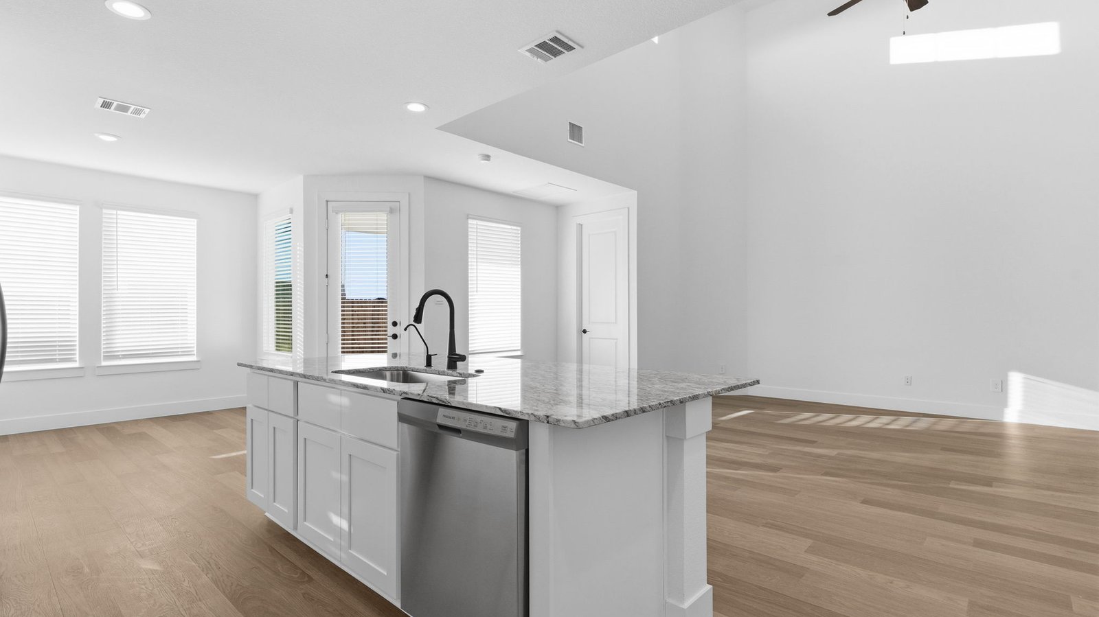 open concept kitchen dining and living room