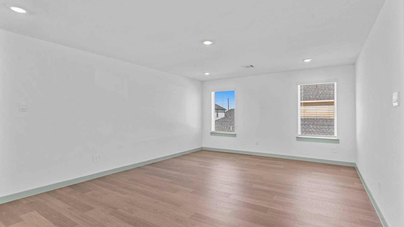upstairs game room with two windows