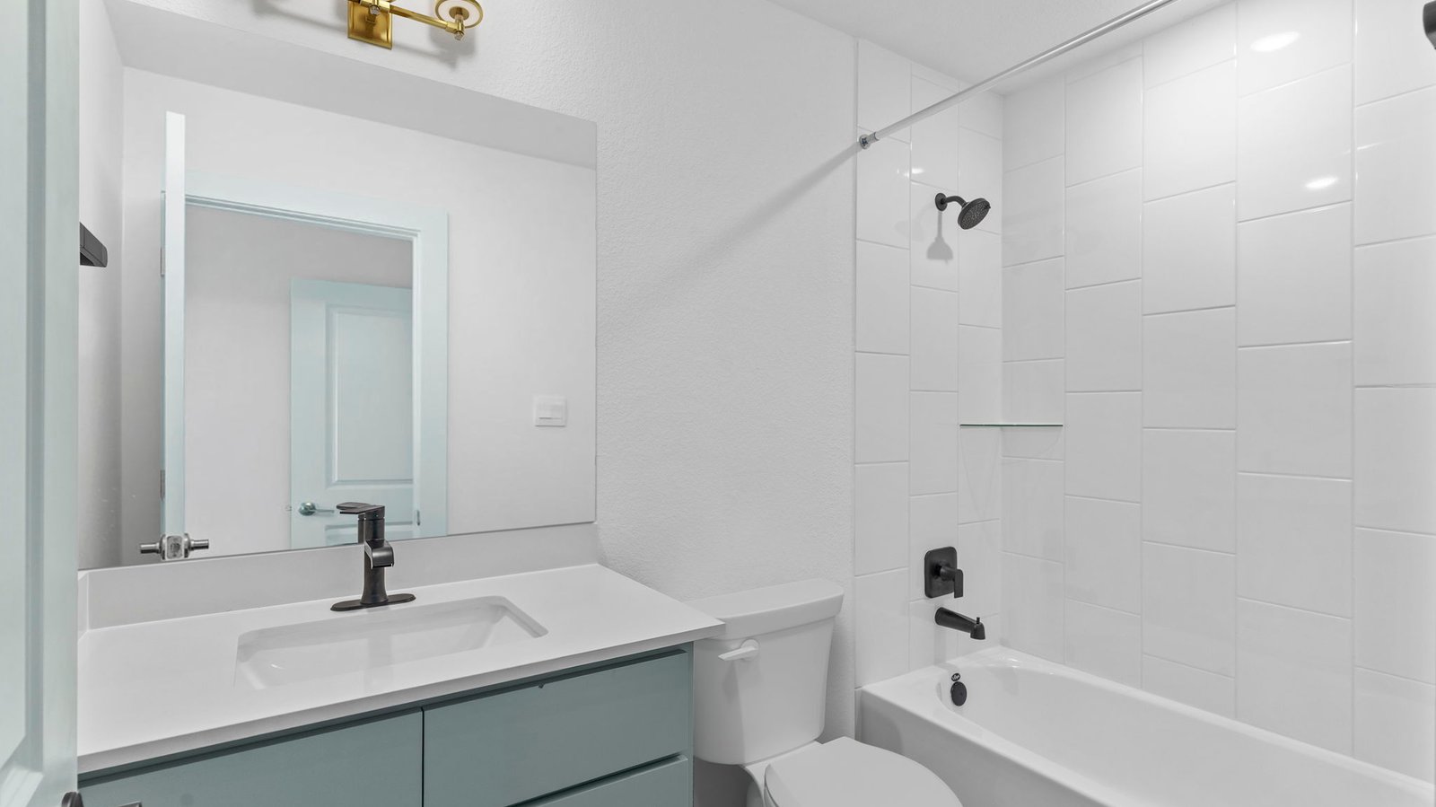secondary bathroom with bathtub and shower combo