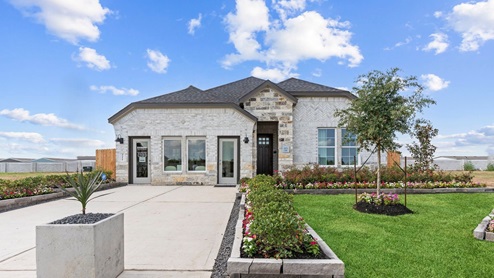 Model Home sales office Front exterior one story Alexander model home with white/lightgray brick and light tan stone, and black siding