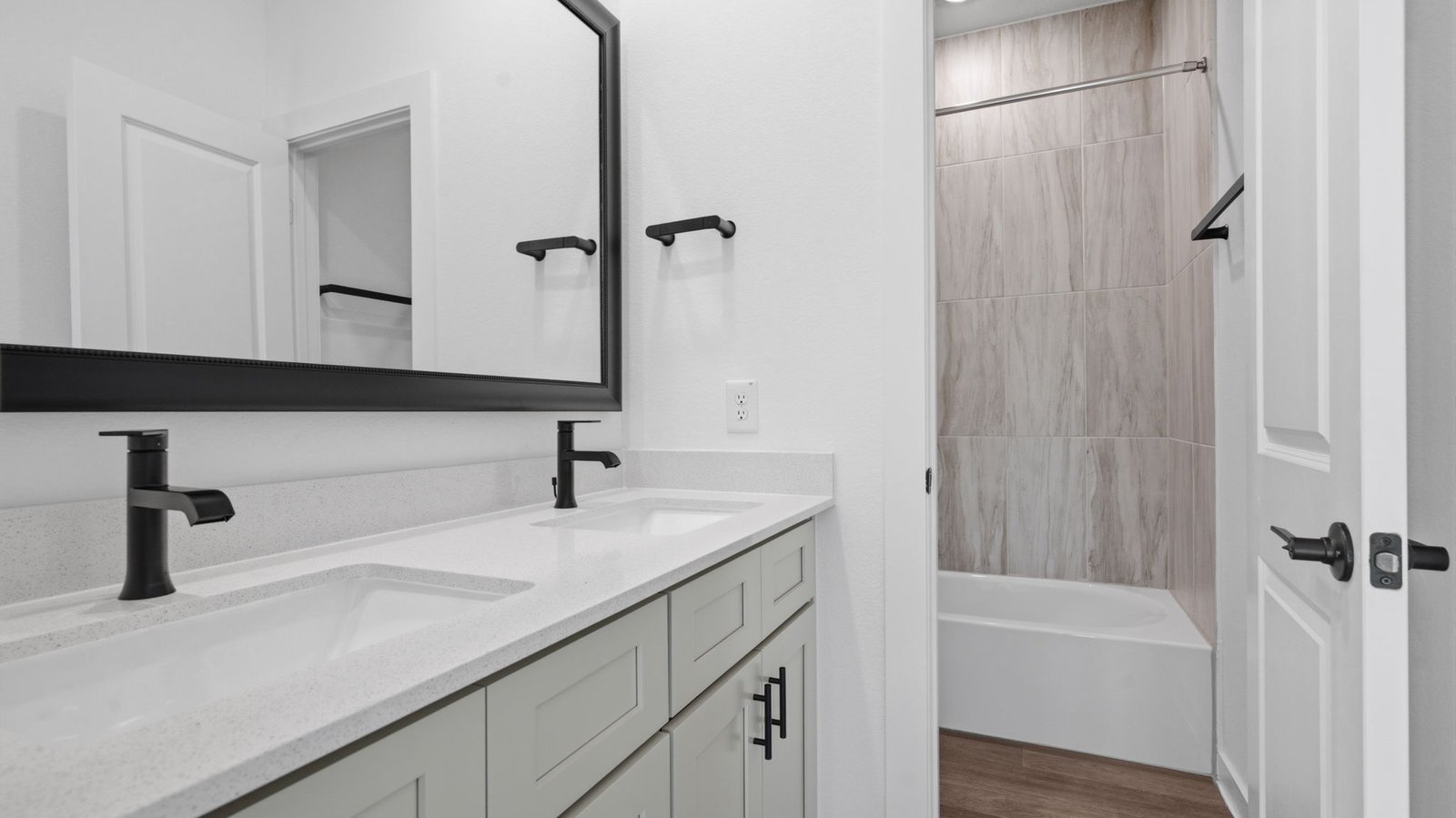 A well-designed bathroom equipped with granite countertops, emphasizing functionality and contemporary style.