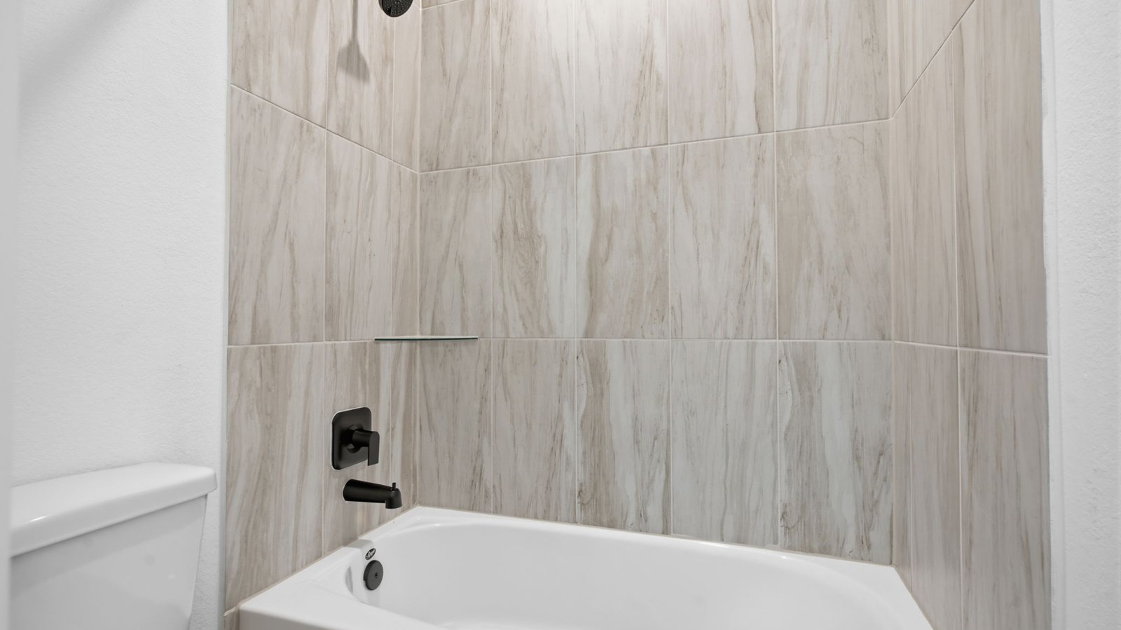 A well-designed bathroom equipped with granite countertops, emphasizing functionality and contemporary style.