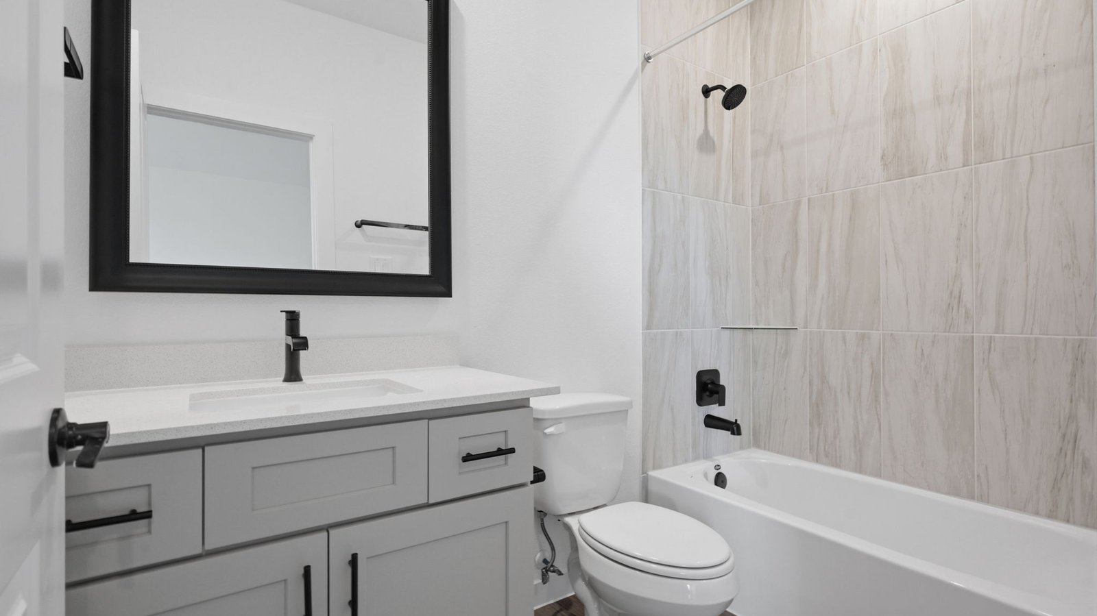 A well-designed bathroom equipped with granite countertops, emphasizing functionality and contemporary style.