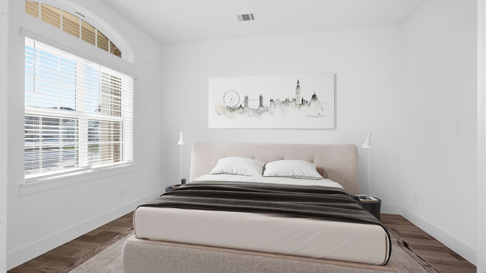 Comfortable guest bedroom featuring neutral-toned walls, carpeted flooring, and a separate closet.