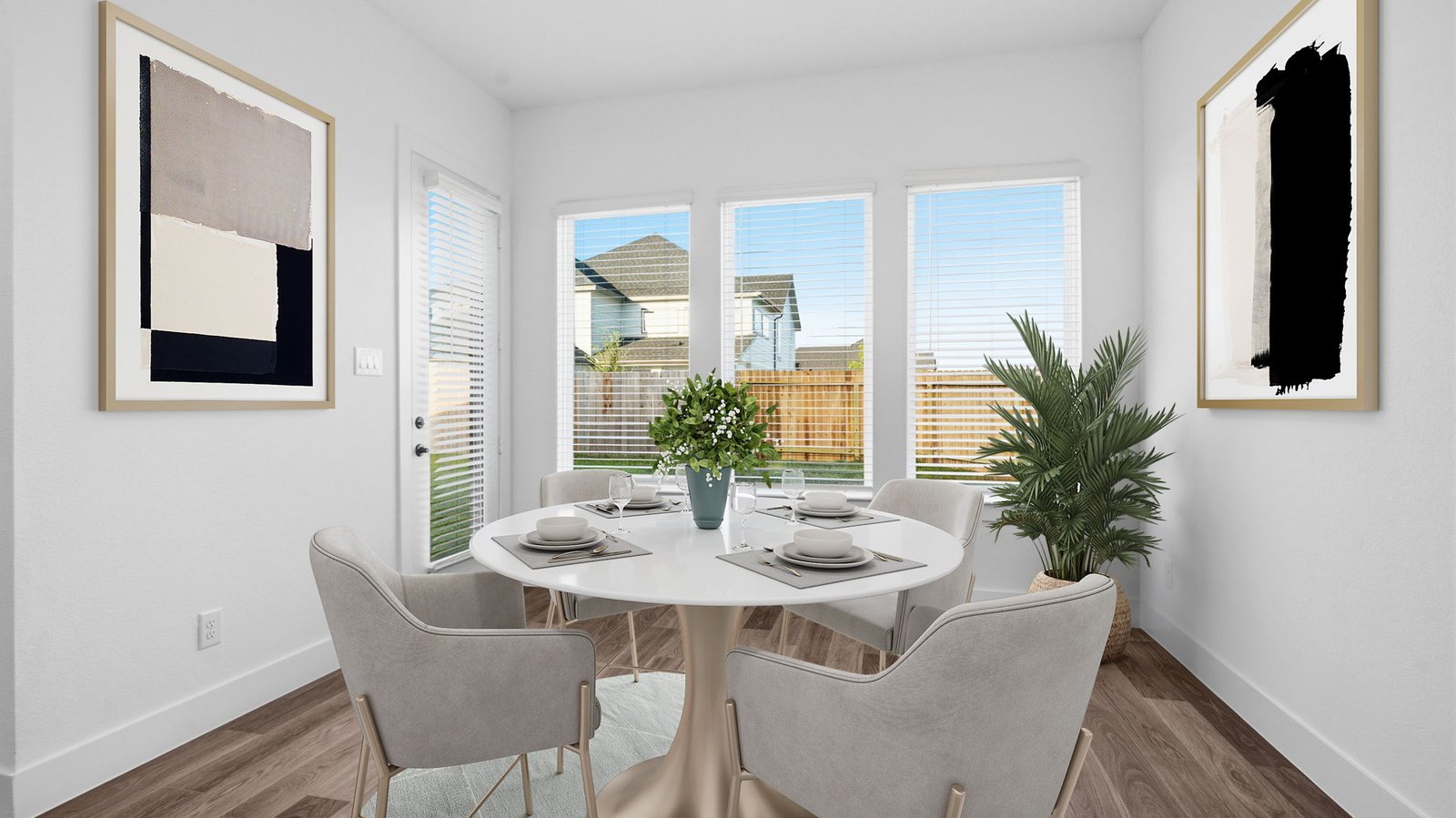An open concept breakfast room with a large window.