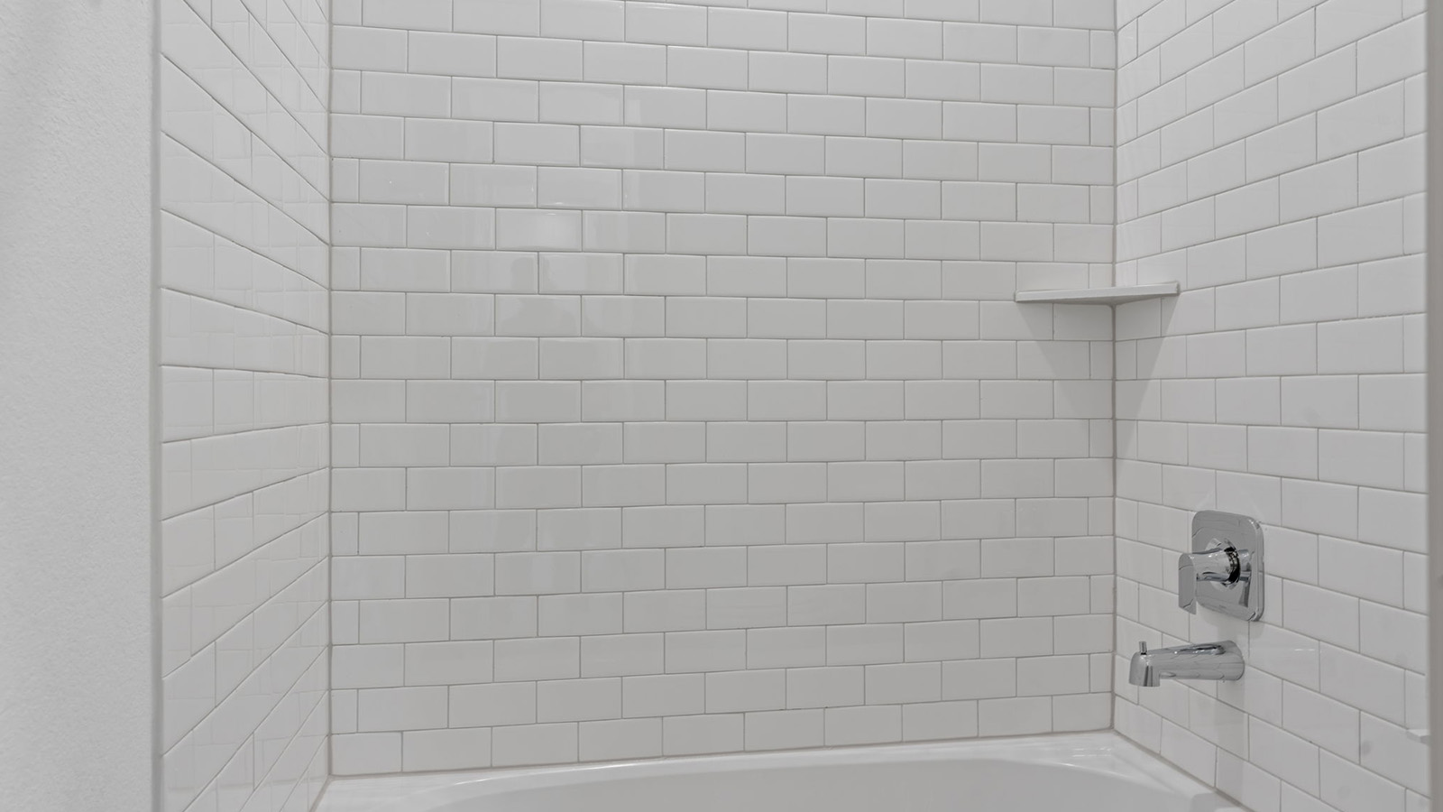 secondary bathroom with one sink tub and shower