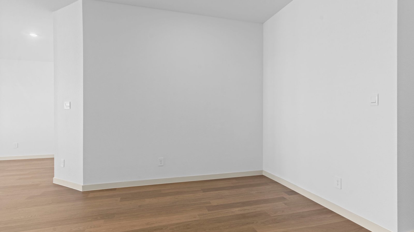 Spacious open concept dining area with vinyl wood flooring and access to the living and kitchen areas